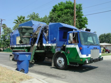 Frontline workers handling commercial waste at a Chiswick site