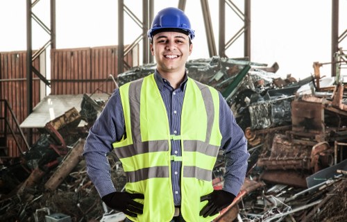 Workers managing builders waste clearance